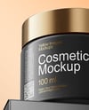 Matte Cosmetic Jars with Paper Box on the Glass Mockup