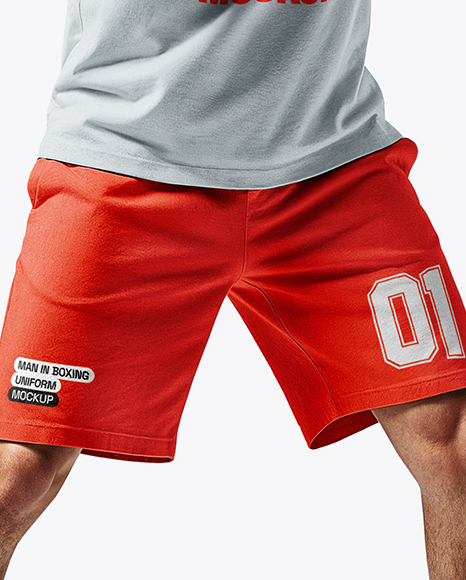 Man Wearing Boxing Sleeveless Hoodie and Shorts with Punching Bag Mockup