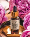 Amber Dropper Bottle with Oil Tincture Surrounded by Flowers Mockup