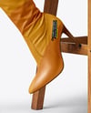 Pair of Over-The-Knee Boots on Women's Legs on Stool Mockup
