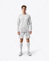 Man Wearing Long Sleeve Raglan Soccer Jersey and Shorts Mockup