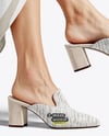 Pair of Suede Mules on Woman's Legs Mockup