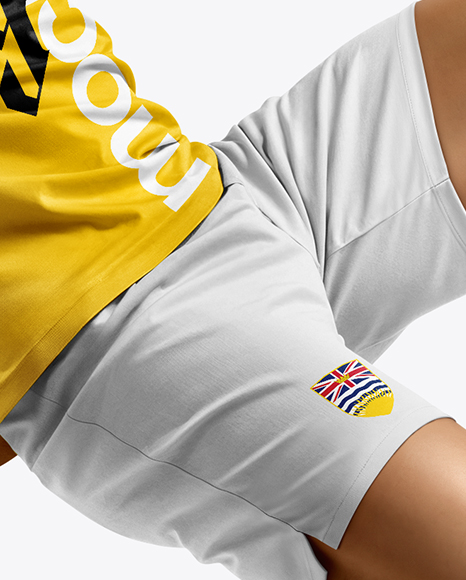 Man Wearing Soccer Jersey and Shorts Mockup
