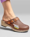 Pair of Clogs on Woman's Legs Sitting on Stool Mockup