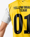 Man Wearing Soccer Jersey and Shorts Mockup