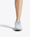 Woman Wearing Golf Shirt and Skirt Mockup
