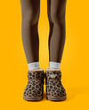 Pair of UGG Boots on Woman's Legs with Leggings Mockup
