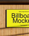 Billboard on a Wall with Wooden Slats Mockup