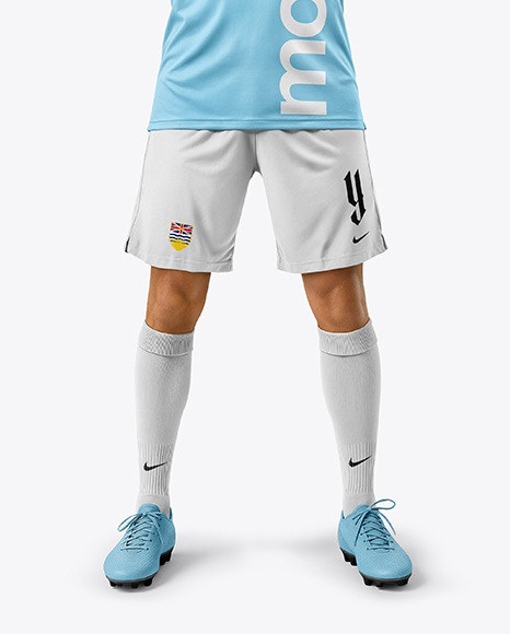 Man Wearing Soccer Jersey and Shorts Mockup