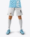 Man Wearing Soccer Jersey and Shorts Mockup