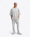 Man Wearing an Oversize T-shirt and Sweatpants Mockup