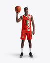 Basketball Player Wearing a V-Neck Jersey and Shorts Holding a Basketball Mockup