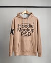 Hoodie on a Wooden Hanger Against a Plain Background Mockup