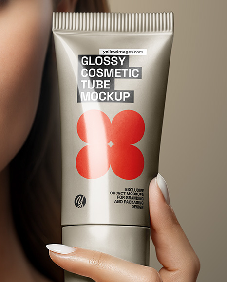 Woman Holding Glossy Cosmetic Tube in a Hand Mockup