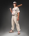 Young Man Wearing a Full Baseball Kit with Bat Mockup