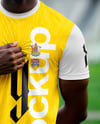 Soccer Player Wearing a Crew Neck Jersey and Shorts at the Stadium Mockup