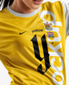 Female Soccer Player Wearing Jersey and Shorts Mockup