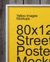 Framed Poster on a Wooden Wall Mockup