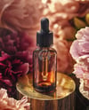 Amber Dropper Bottle with Oil Tincture Surrounded by Flowers Mockup