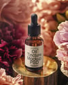 Amber Dropper Bottle with Oil Tincture Surrounded by Flowers Mockup