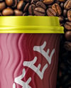 16oz Paper Cup on a Stack of Coffee Beans Mockup