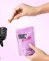 Dog and Hand Holding Stand-Up Pouch Mockup