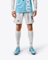 Man Wearing Long Sleeve Raglan Soccer Jersey and Shorts Mockup