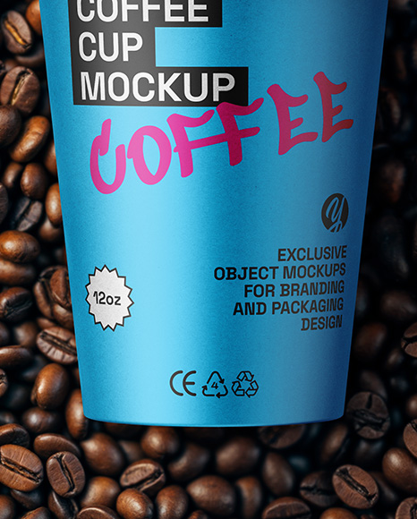 12oz Paper Cup on a Stack of Coffee Beans Mockup