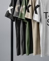 Five T-Shirts on a Wooden Hanger Against a Plain Background Mockup