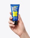 Matte Cosmetic Tube in a Hand Mockup