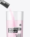 Matte Stick Sachet With Powder in a Hand & Water Glass Mockup