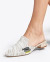 Pair of Suede Mules on Woman's Legs with Skirt Mockup