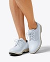 Woman Wearing Golf Shirt and Skirt Mockup