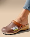 Pair of Clogs on Woman's Legs Sitting on Block Mockup