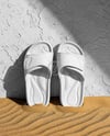 Slide Sandals Next to The Wall Mockup