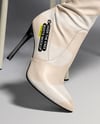 Pair of Over-The-Knee Boots on Women's Legs on Stool Mockup