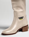 Pair of High-Knee Boots on Women's Legs with Dress Mockup