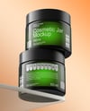 Two Amber Cosmetic Jars on the Glass Mockup