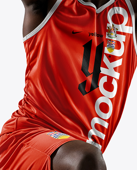 Basketball Player Wearing Jersey and Shorts Holding a Basketball Mockup