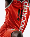 Basketball Player Wearing Jersey and Shorts Holding a Basketball Mockup