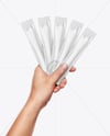 Five Sachets in a Hand Mockup