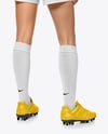 Female Soccer Player Wearing Jersey and Shorts Mockup