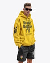 Young Man Wearing Oversize Hoodie and Shorts Mockup