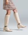 Pair of High-Knee Boots on Women's Legs with Dress Mockup