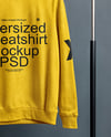 Sweatshirt on a Wooden Hanger Against a Plain Background Mockup
