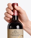 Red Wine Bottle in Hands Mockup