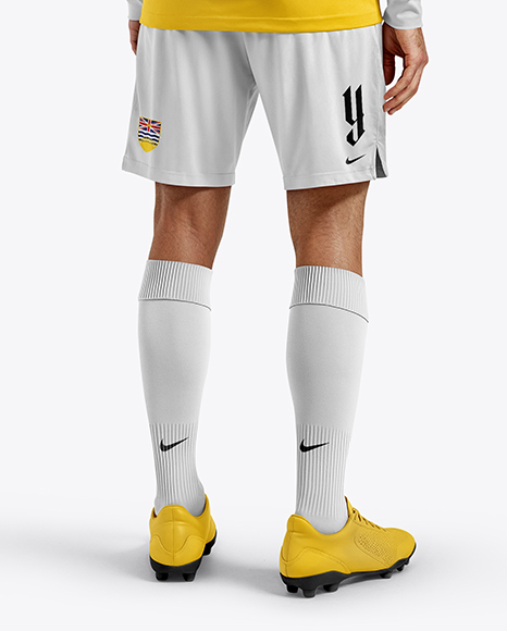 Man Wearing Long Sleeve Soccer Jersey and Shorts Mockup