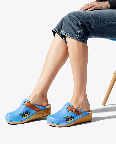 Pair of Clogs on Woman's Legs Sitting on Stool Mockup