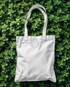 Tote Bag on a Leafy Greens Background Mockup