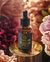 Amber Dropper Bottle with Oil Tincture Surrounded by Flowers Mockup
